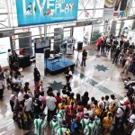 UNHCR workers briefing the KL Sentral crowd on World Refugee Day.
