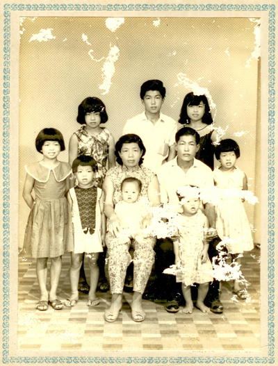 Chong Eng, standing far left, with her family