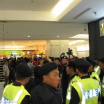Police proceeded to the shopping mall entrance, forcing the gathering to retreat further into the mall. After a few minutes of scuffle, grilles were pulled down, creating a barrier between the police and the protesters.