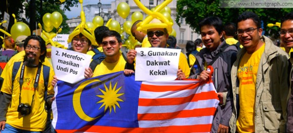 Protesters in yellow during the Bersih 2.0 demonstration in London