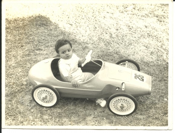 In his sports car, aged one