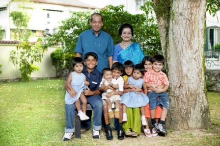 Premesh's parents with their eight grandchildren in 2006 in Malaysia.