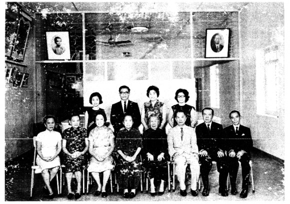 Maria's paternal great-grandmother, who is the second wife, sits fourth from right with the first wife's children. She did not bear any children herself.  