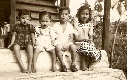 Standard One, at grandma’s house in Selama, Perak, with second/third cousins on father’s side.