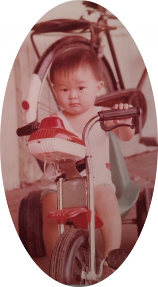 Three-year-old Liew riding a bicycle around his old home in Jinjang, Kuala Lumpur.