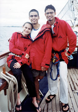 With her brothers, Ashraf and Adam, on the vessel STS Leeuwin II in Freemantle, Australia in 2001