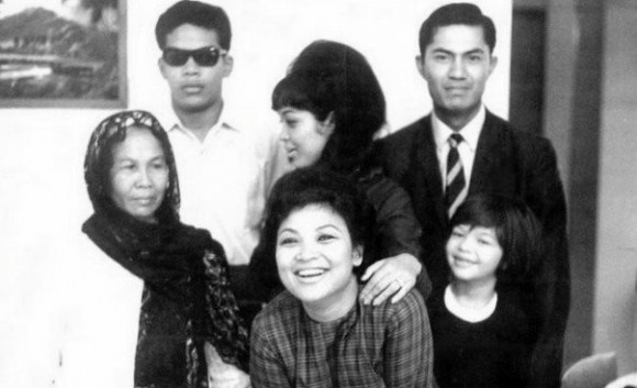 Liyana (bottom right), with her mother (middle, back), her maternal grandmother (front, centre) and other family members in an old photo from the 70s.